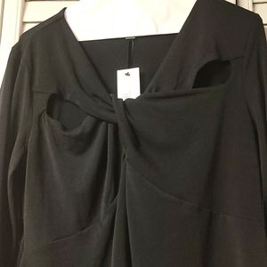 Ladies black long sleeve top. Features two peep cut outs across each shoulder.